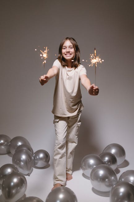Young girl with sparklers celebrating
